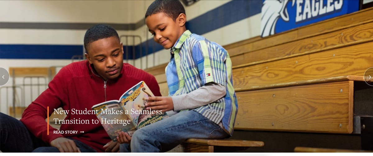 Heritage Christian School homepage photo of student reading with younger boy